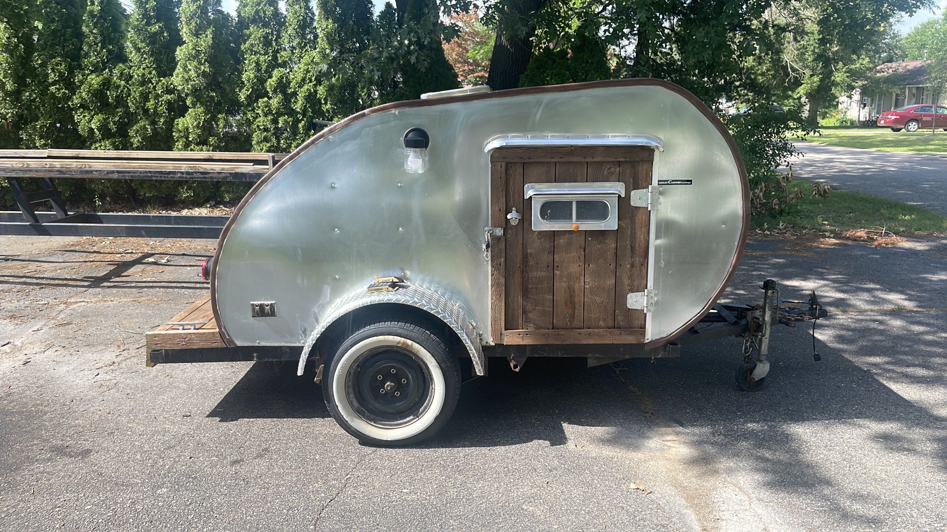 Side view with the handmade wood door and vintage porch light