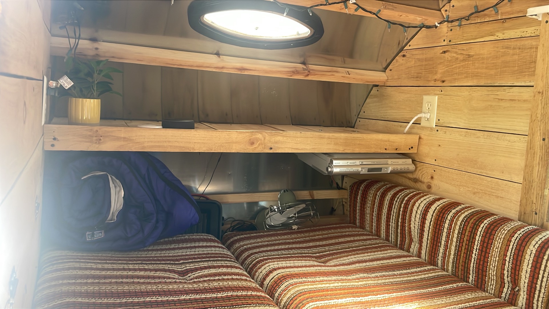 Interior shelving with radio, fan, and 120V outlets