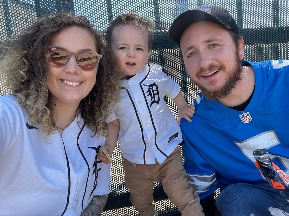 Nick with his wife and son at a Detroit Tigers game